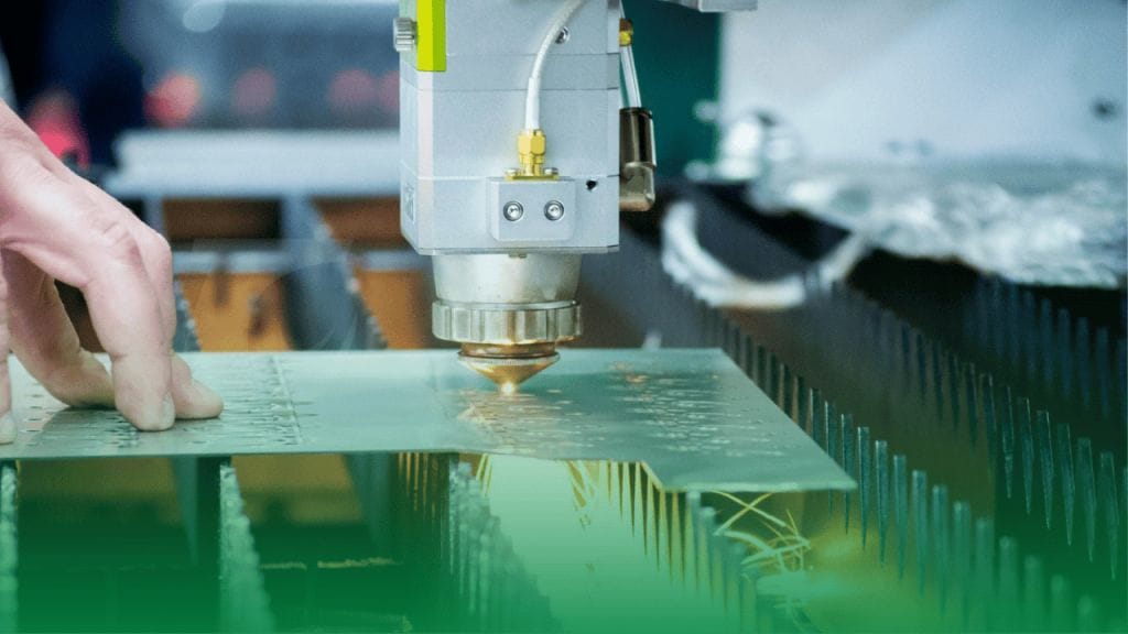 Laser cutting machine precisely cutting sheet metal with a focused laser beam, creating intricate shapes